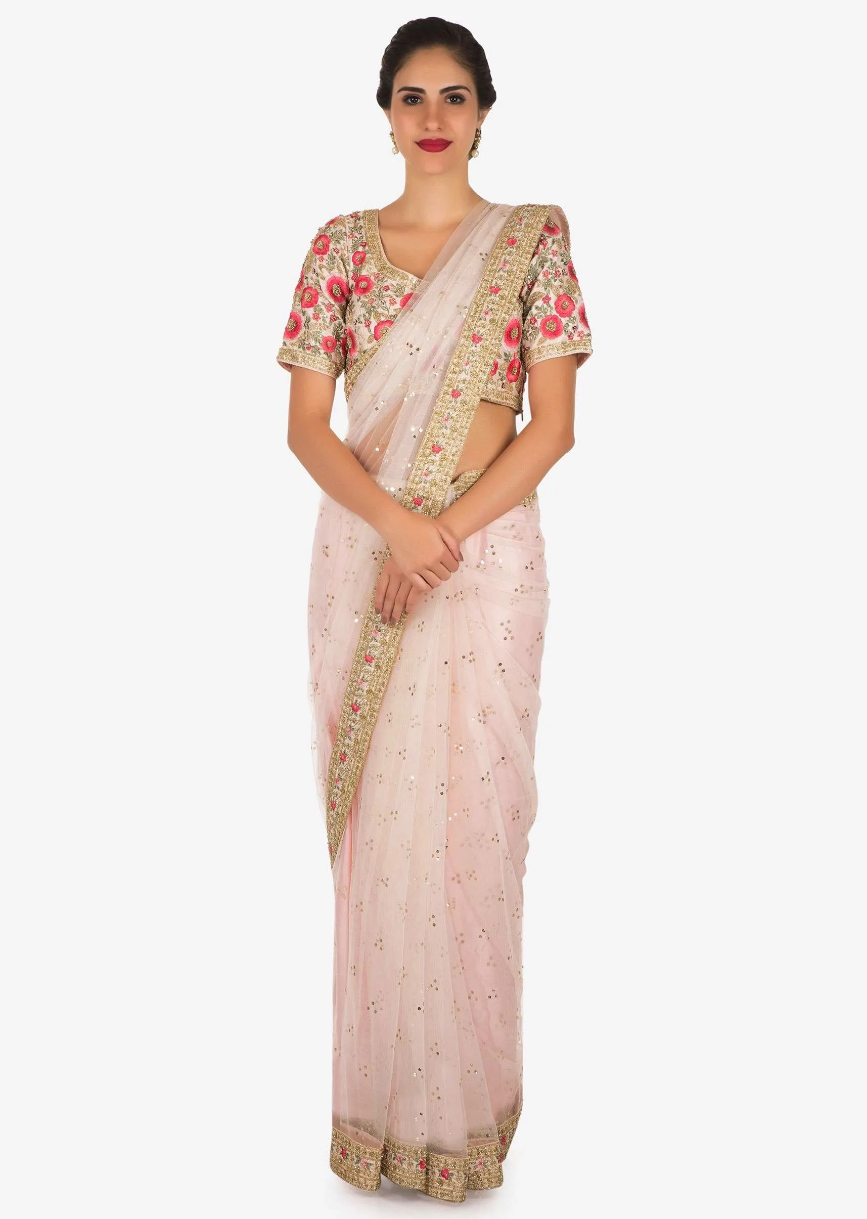 Baby pink saree in net with a ready raw silk blouse beautified in resham work only on Kalki
