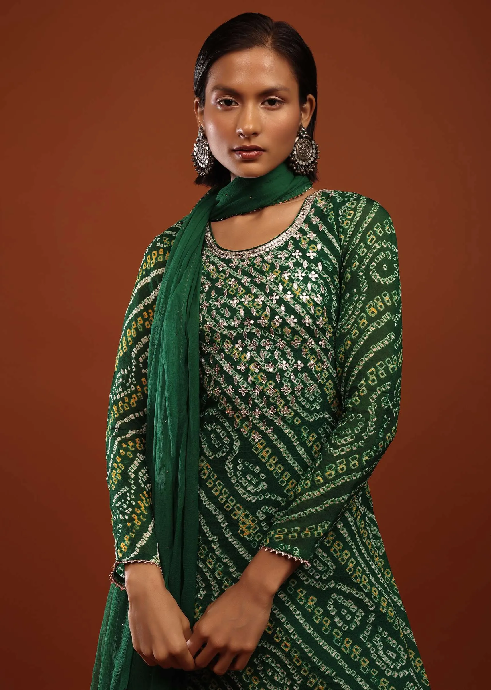Bottle Green Straight Cut Suit In Georgette With Bandhani Print And Gotta Embroidered Yoke
