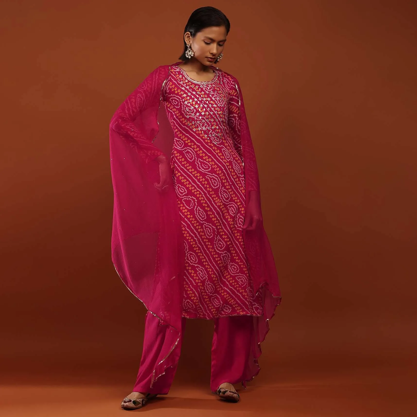 Magenta Pink Suit In Georgette With Bandhani Print And Gotta Embroidered Yoke