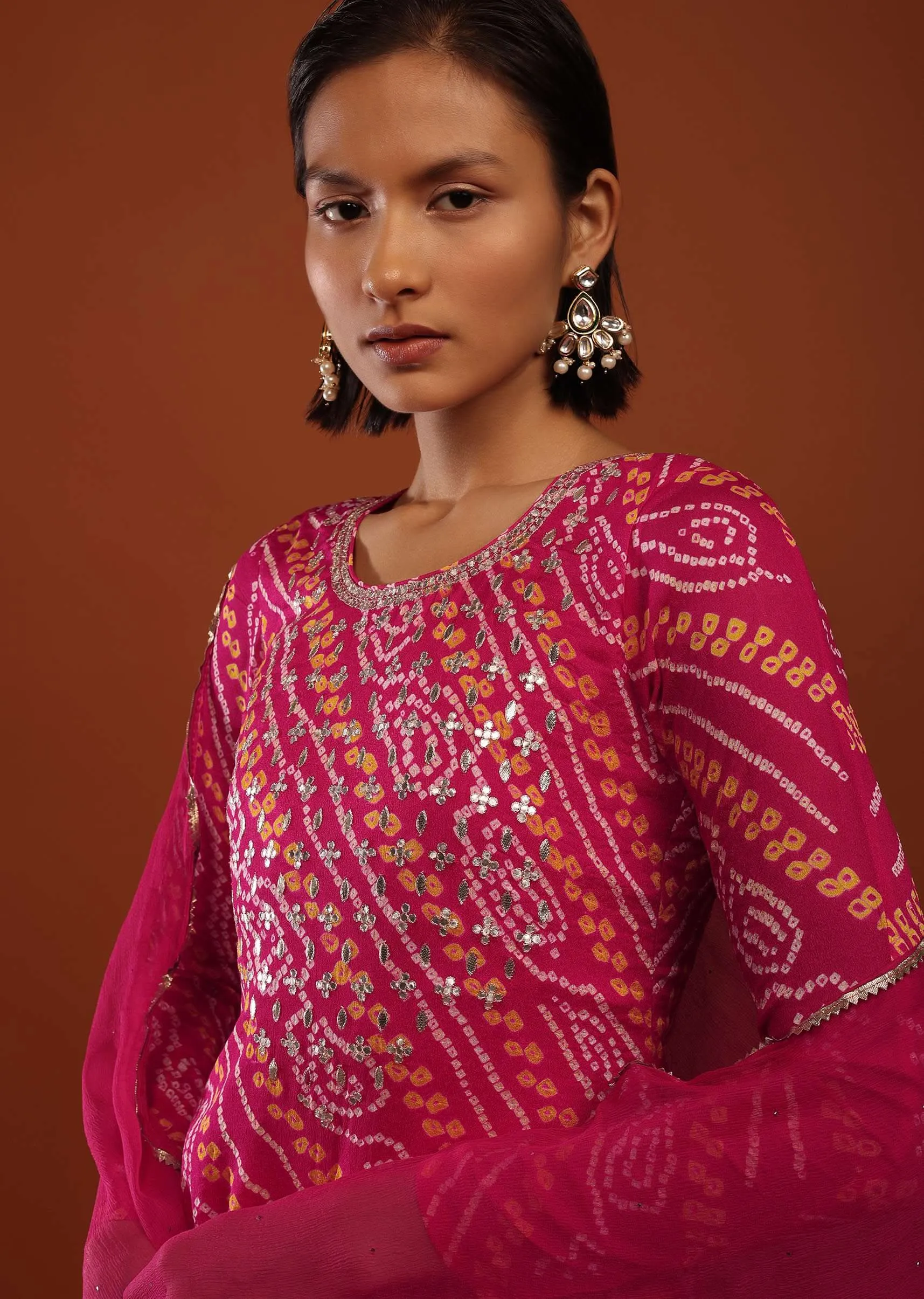 Magenta Pink Suit In Georgette With Bandhani Print And Gotta Embroidered Yoke