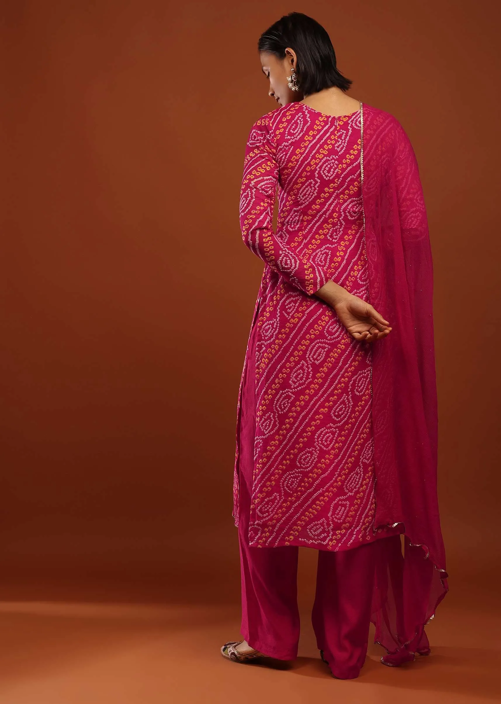 Magenta Pink Suit In Georgette With Bandhani Print And Gotta Embroidered Yoke