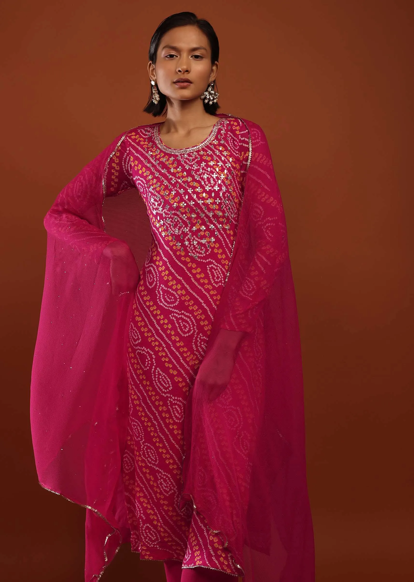 Magenta Pink Suit In Georgette With Bandhani Print And Gotta Embroidered Yoke